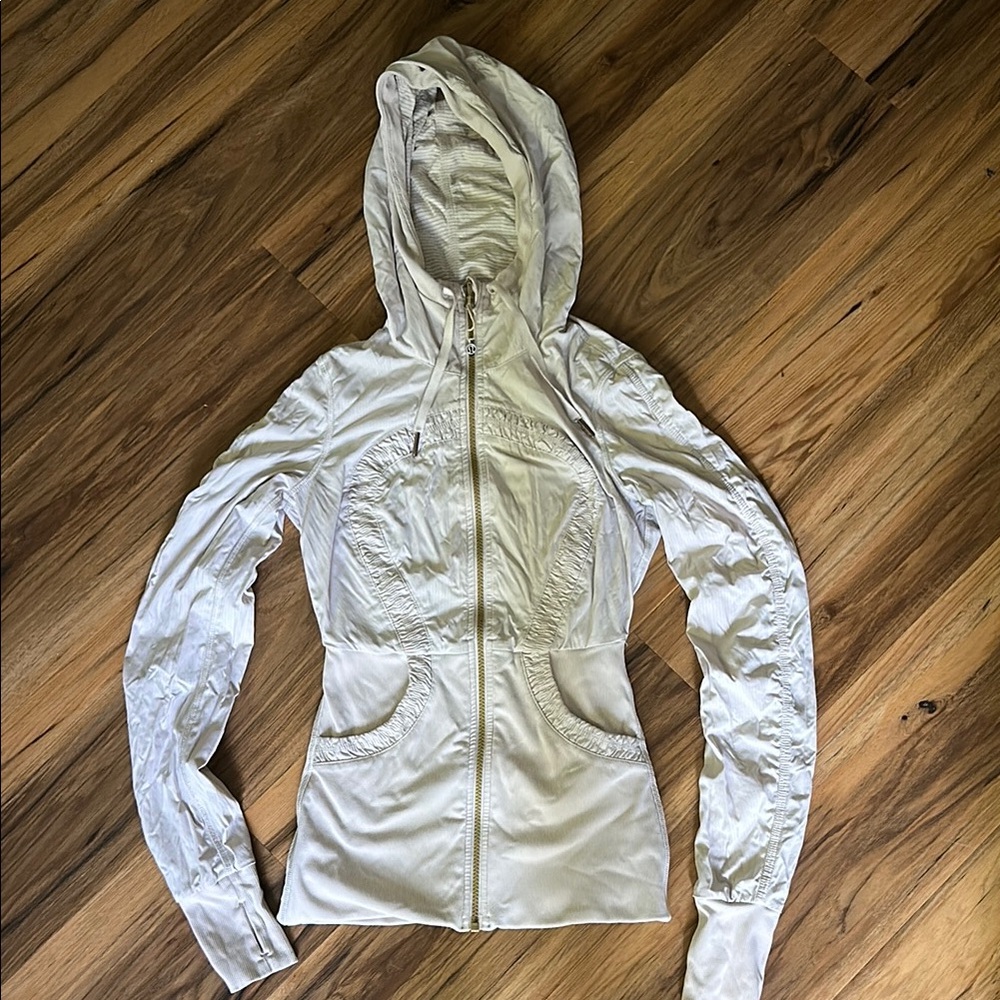 Lululemon Athletica cream colored reversible jacket.
